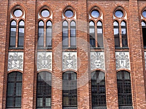 Facade of an old building made of red bricks