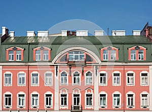 Facade of an old building with a mansard roof