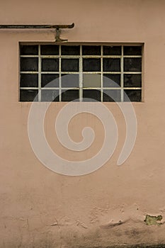 Facade of an old building with metal windows and rungs Goal bar