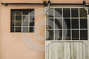 Facade of an old building with metal windows and rungs Goal bar