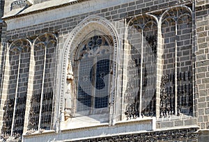 Facade of an old church, with chains pending