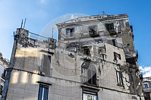 Facade of an old classic building in Naples, Italy