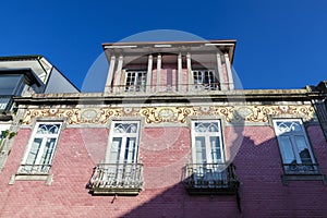 Facade of an old classic red building, Braga, Portugal