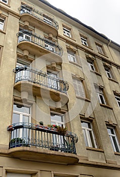 Facade old European building with balcony autumn