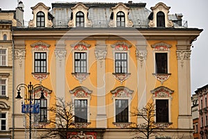 Facade of old historical building on Main Market Square, Old Town, Krakow, Poland