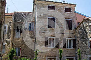 Facade of an old ruined house in the old town of Porec Parenzo, in the Istrian Peninsula, Croatia