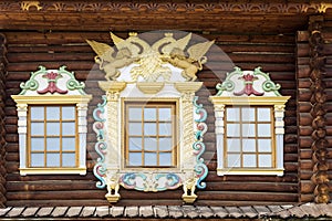 facade of the old Russian chopped house with carved wooden architraves