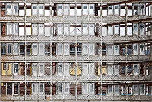 Facade of an old skyscraper ready for renovation