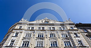 Facade of the ornate historical apartment biulding in the center of Vienna, Austria