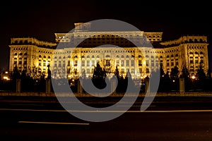 Facade of the Palace of Parliament at night in Bucharest, Romania.