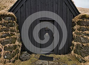 Facade of a peat house in Iceland near Hella