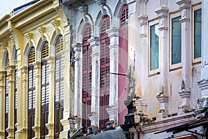 Facade perspective of ancient buildings. Colorful facade, arched windows in antique style. photo