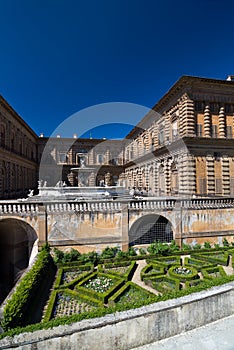 Facade of Pitti Palace with fountain and Boboli Gardens