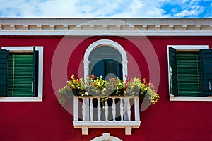 Facade of raspberry colored house
