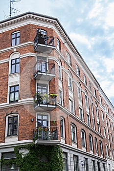 Facade of red brick Building with Balconies, Copenhagen