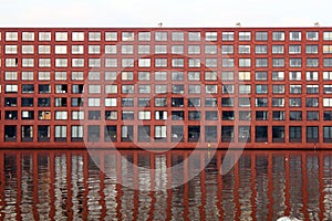 Facade and reflection of brick building