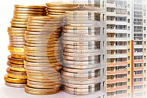 The facade of a residential high-rise house on a background of money .