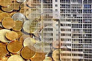 The facade of a residential high-rise house on a background of money .