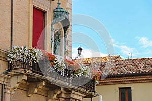 Facade of Rimini City Hall with statue on Cavour square in Rimini, Italy