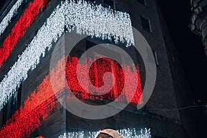 Facade of Rinascente department store on Corso Vittorio Emanuele ii near Duomo in Milan, Italy. The shop is lit up with photo