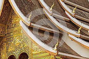 Facade and roof decoration of the Haw Pha Bang Buddhist temple at the Royal Palace Museum in Luang Prabang, Laos.