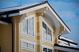 Facade and roof of a modern wooden house