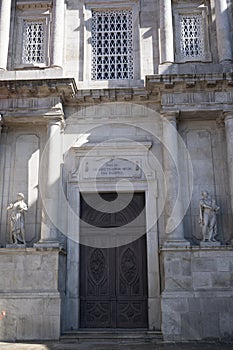 Facade of S. Francisco church. Roman style details on the rock and statues. Latin words over the door. Beautiful details on the
