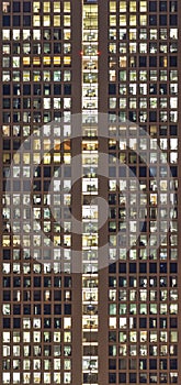 Facade of skyscraper in the evening with offices as symbol for w photo