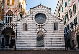The facade of the small church of `San Matteo` XII century, in the downtown of Genoa photo