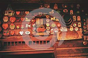 Facade of a small log house with colorful decorations.