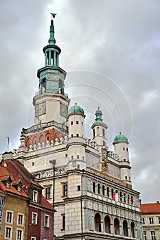 The facade with stone arcades and tower of the historic Renaissance town hall