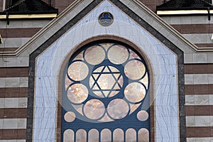 the facade of the synagogue. The star of David is in window