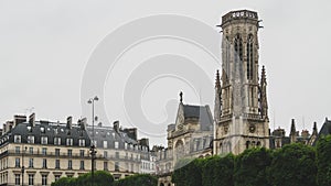 Facade and tower of Saint-Germain-l`Auxerrois Church in downtown Paris, France