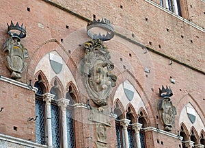 facade of the Town Hall in Tuscany with the shield with SIX BIG BALLS symbol of the Medici dynasty
