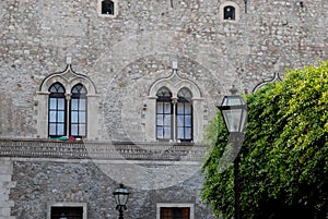 Facade, with two twin windows, in a historic building in Syracuse in Sicily