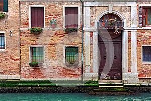 Facade of typical brick building in Venice, Italy.