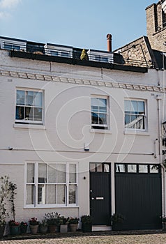 Facade of a typical mews house with a garage in London, UK