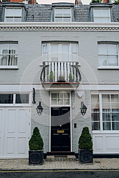 Facade of typical mews house with Juliet balcony in London, UK
