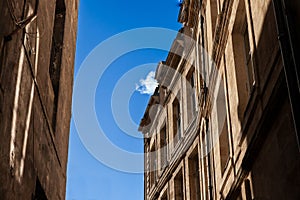 Facade of a typical old French residential building in Bordeaux, France, made of freestone