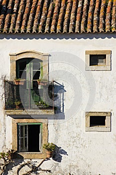 Facade. Typical whitewashed house. Obidos. Portugal