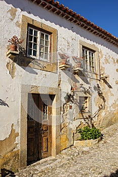 Facade. Typical whitewashed house. Obidos. Portugal