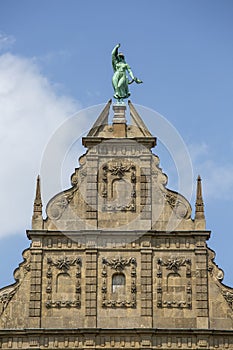 Facade of University Museum, statue of the top, Torun, Poland