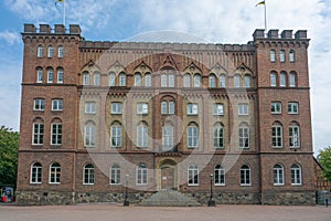 Facade view of the AF-Borgen building under a blue sky with white clouds, Lund, Sweden