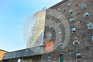 Facade view of brick wall and window of old sugar factory building