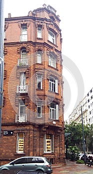 Facade view of a neoclassical brick building, in Republica Arabe and Cabello streets. Buenos Aires, Argentina photo