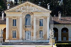 Facade of villa with four massive columns