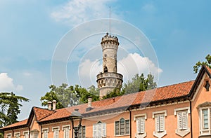 Facade of Villa Mirabello with tower Robbione within the complex of the gardens of the Estense Palace of Varese, Italy