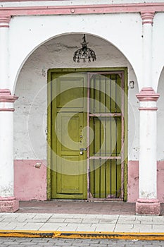 Facade of a white and pink traditional house