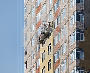 Facade work and insulation of a multistory building