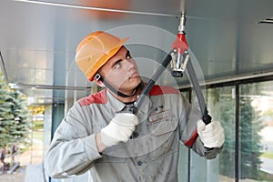 Facade worker with rivet tool photo